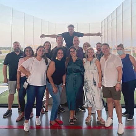 Group of coworkers posting for a happy photo