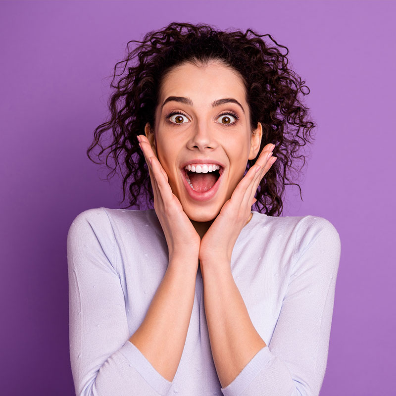 A woman is surprised by the results of overhead music marketing in the USA