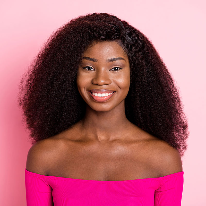 A woman is happy with the results of overhead music marketing in the USA