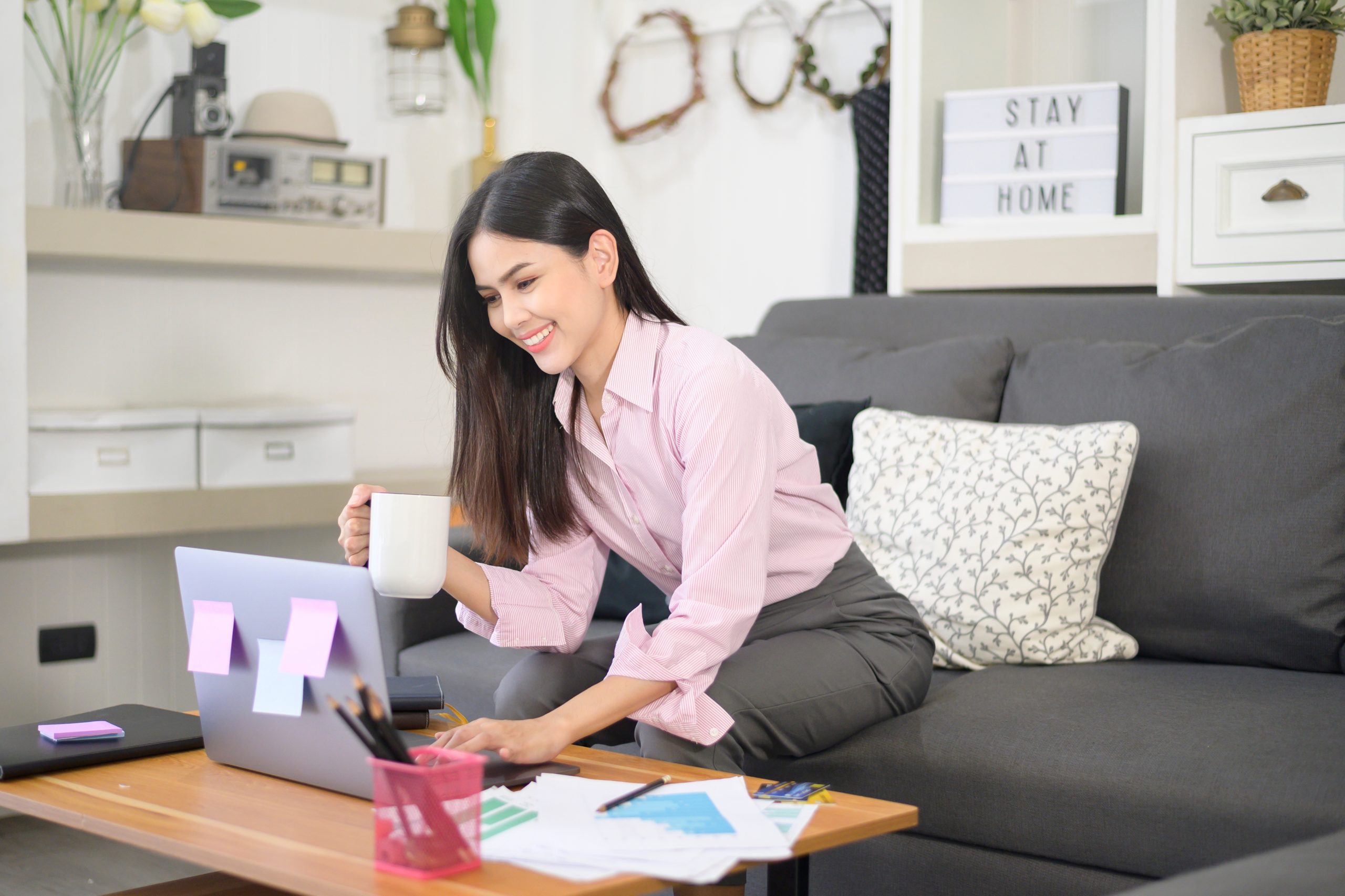 woman working from home on her couch